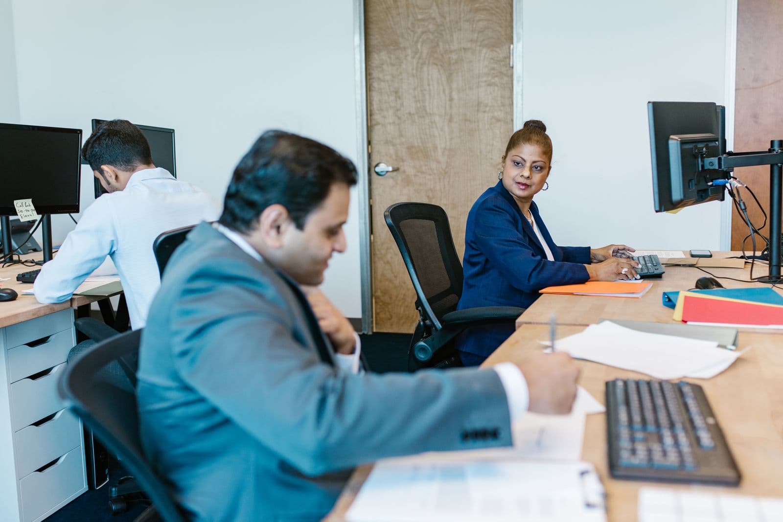 The Vsolwit team collaborating in a modern office